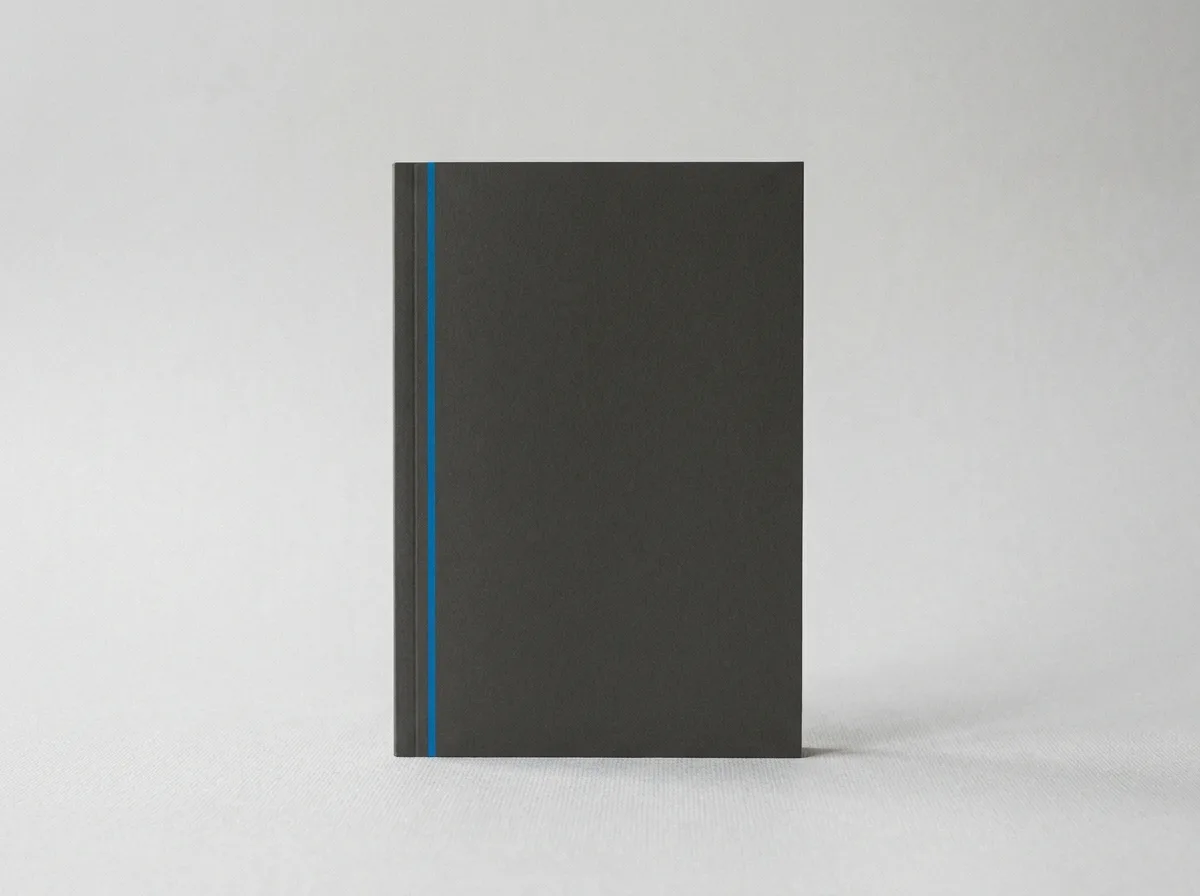 The cover of the E-Book The Purpose of Social Media in Your Outdoor Living Business, a charcoal booklet with a single ocean-blue accent line