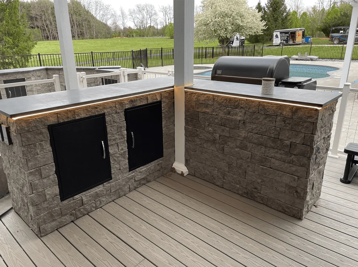 A social post showing an outdoor kitchen going in on a new deck
