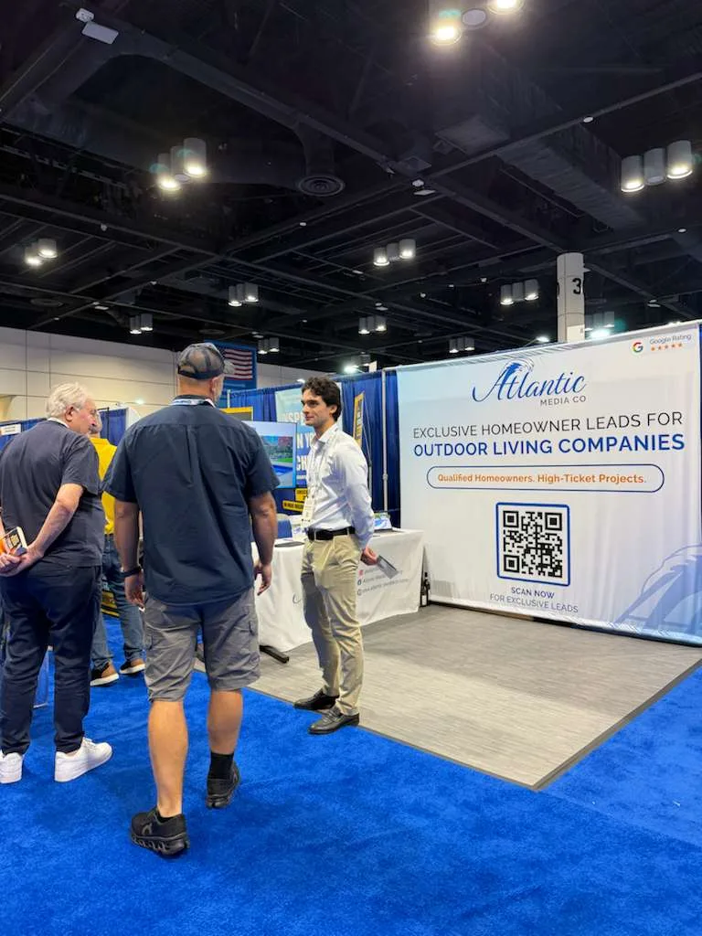 Attendees gathered near the Atlantic Media Company booth on a busy show floor